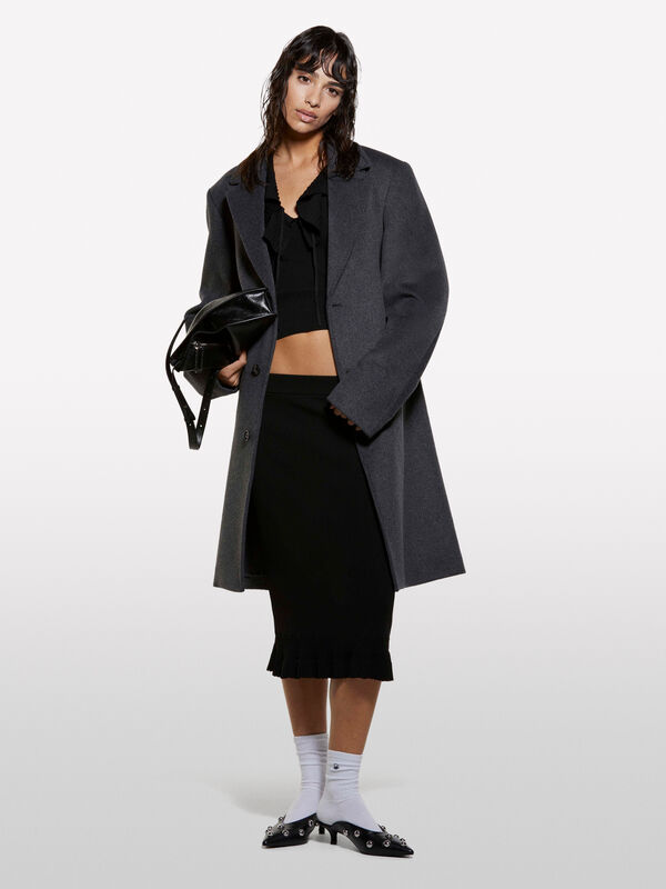 Haut en tricot noir à volants - hauts pour femme | Sisley